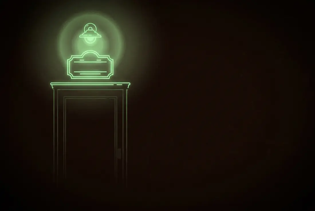 a glowing address plaque hanging above a dark door, a soft halo of porch light around it