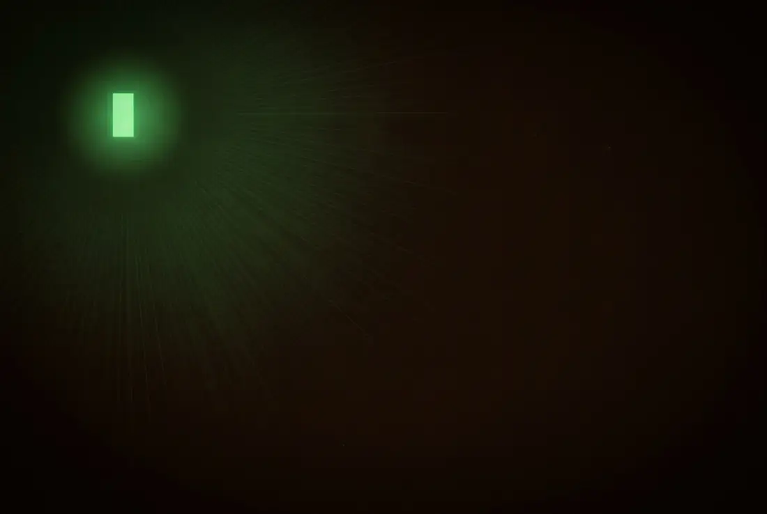 a single glowing text cursor at the start of an empty dark page, light spreading from it like dawn