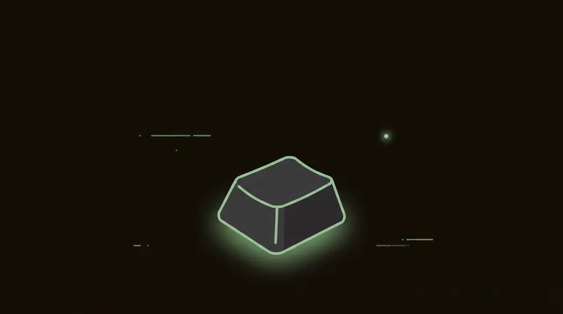 a single dark keyboard key glowing faintly green on black